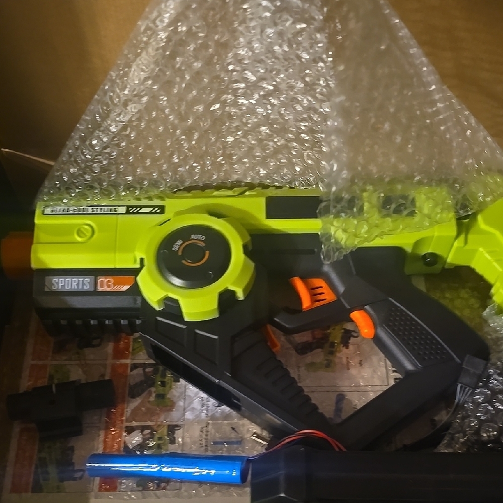 Green and Black Toy Blaster
